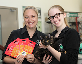 Greencross veterinarians hold a happy cat