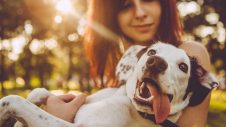 A lady hugging her dog